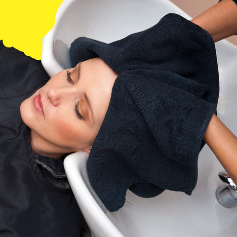 Folded SIMPLI-MAGIC black towels show plush terry and generous size