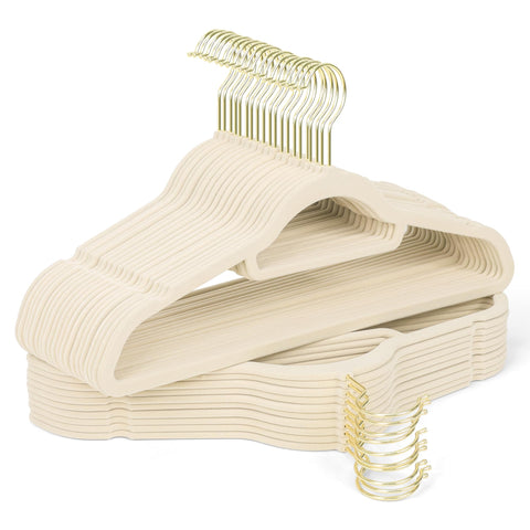 Sishynio velvet hangers with gold hooks cradle a beige dress, preventing slips and wrinkles.