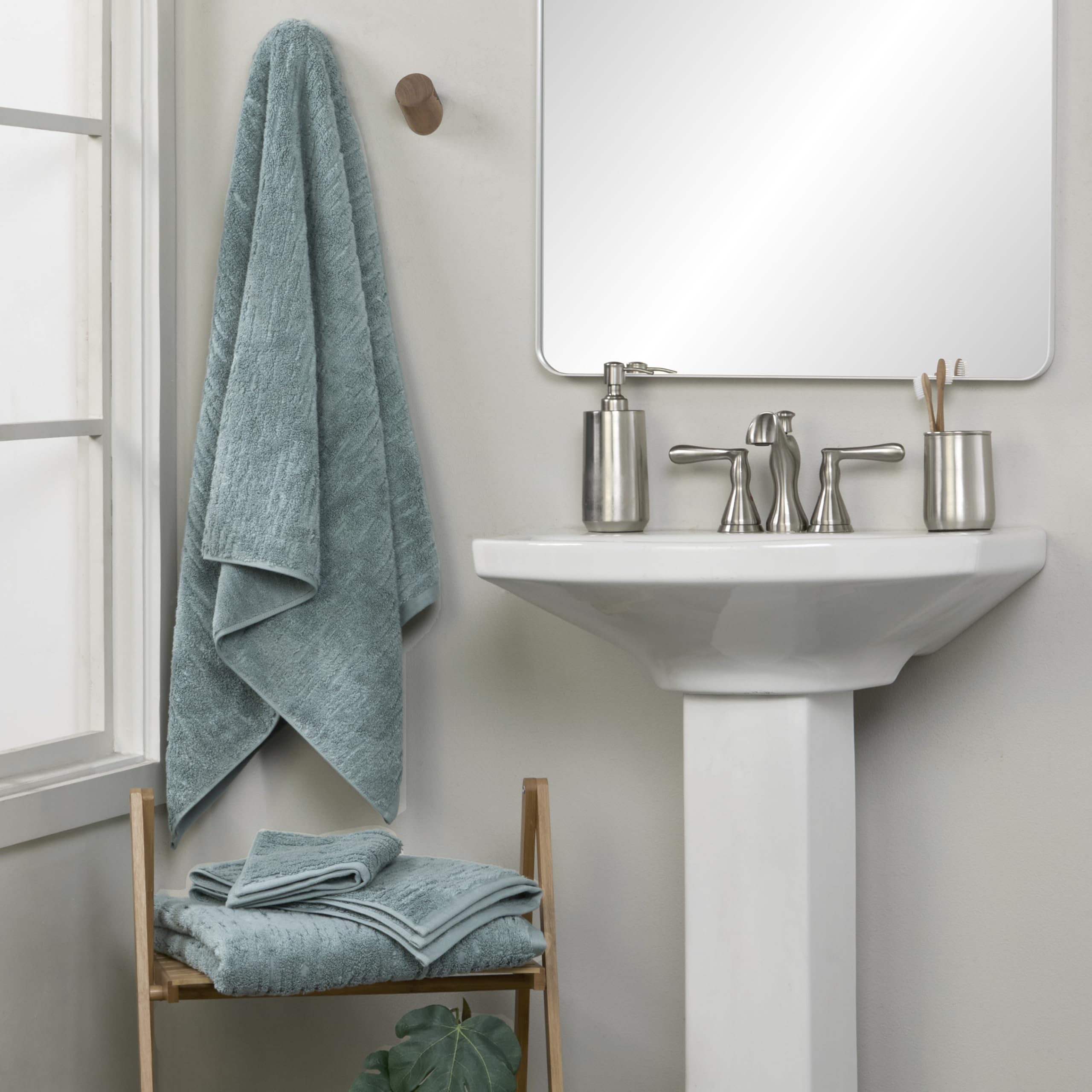 Dense 600 GSM teal CloudSoft towel demonstrates plush absorbency
