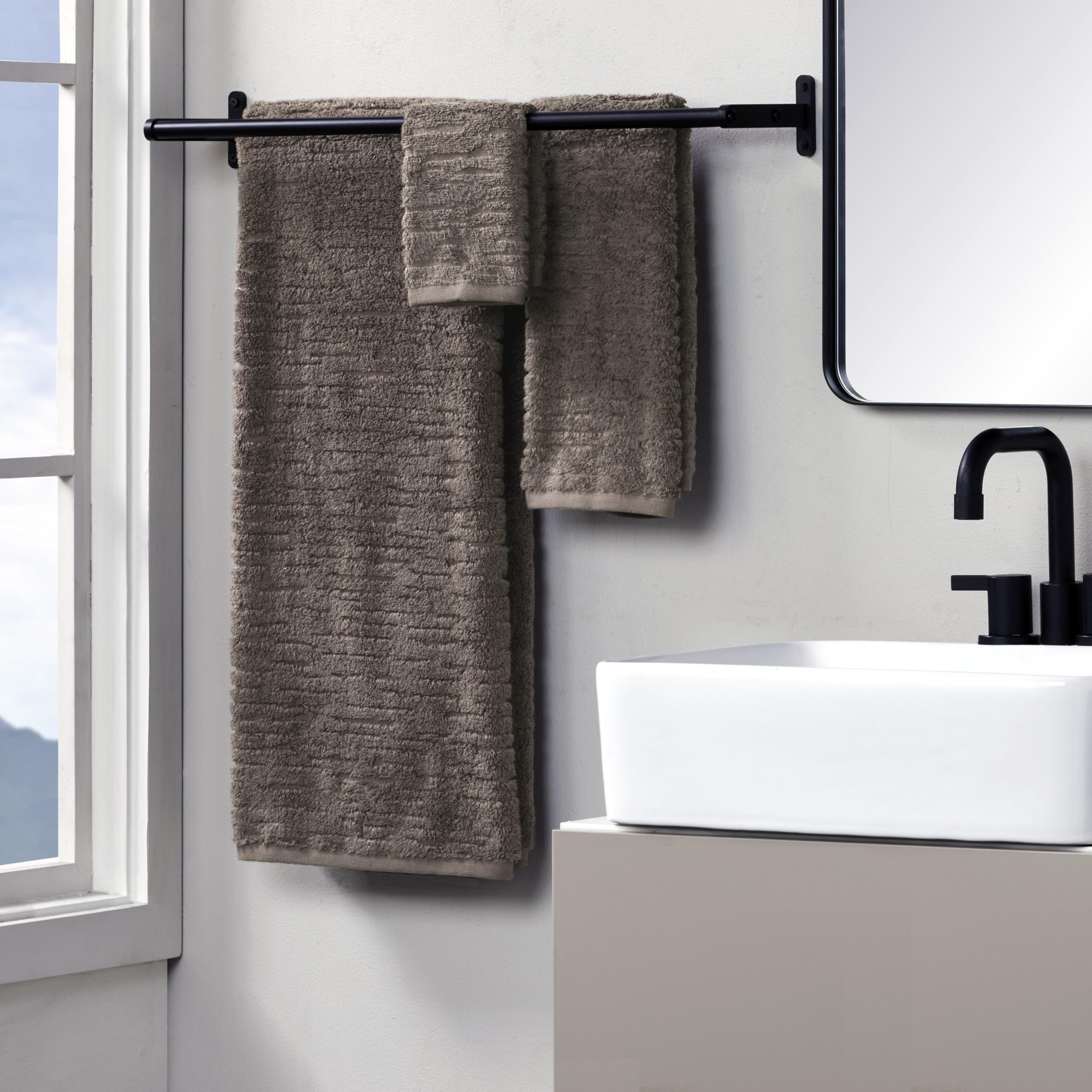 Closeup of CloudSoft hand towel texture and plushness in mink brown