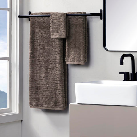 Closeup of CloudSoft hand towel texture and plushness in mink brown