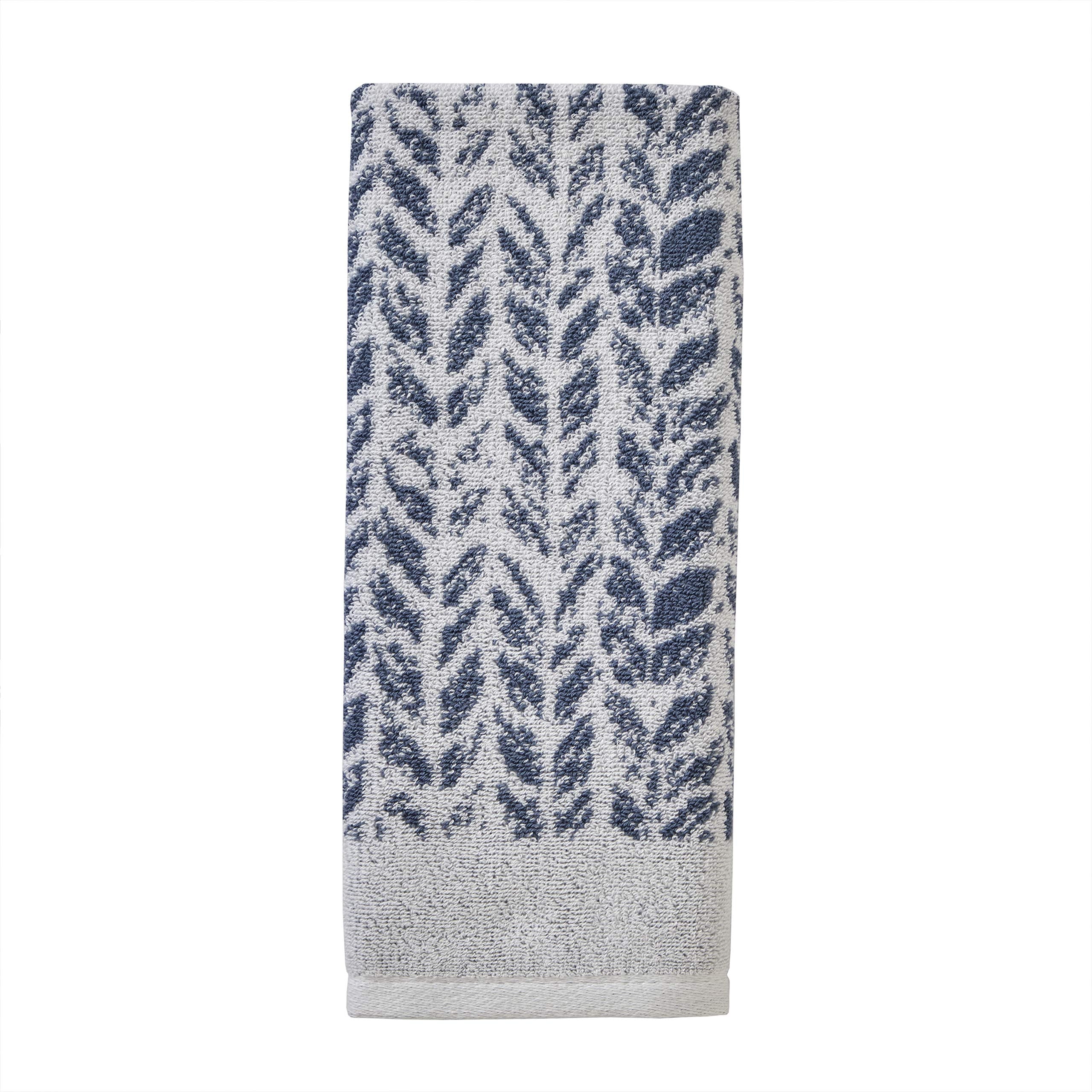 SKL Home Distressed Leaves hand towel laid flat to show two-tone weave and decorative appeal