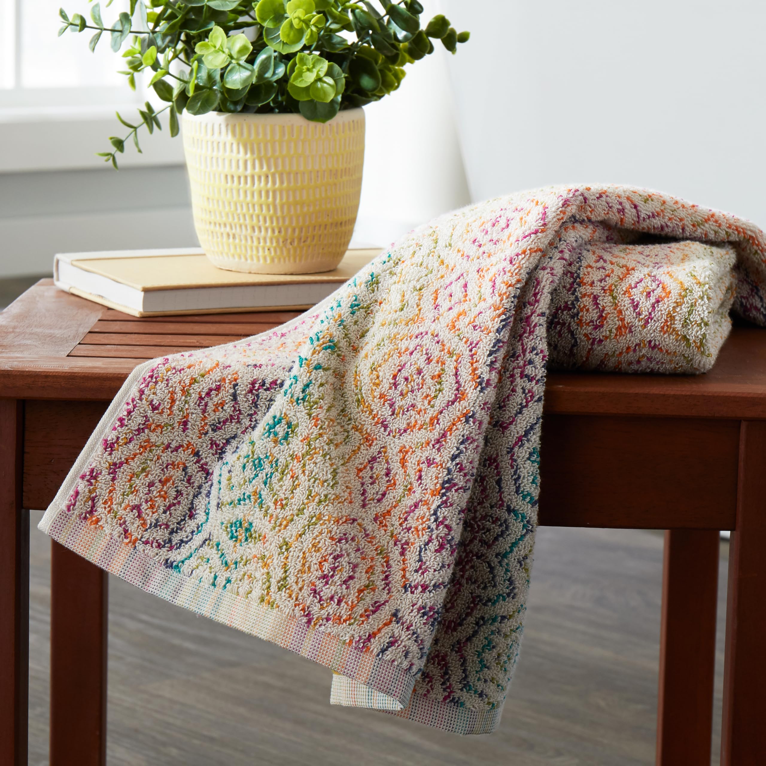 SKL Home Rhapsody hand towels reveal a reversible jacquard design for versatile styling.