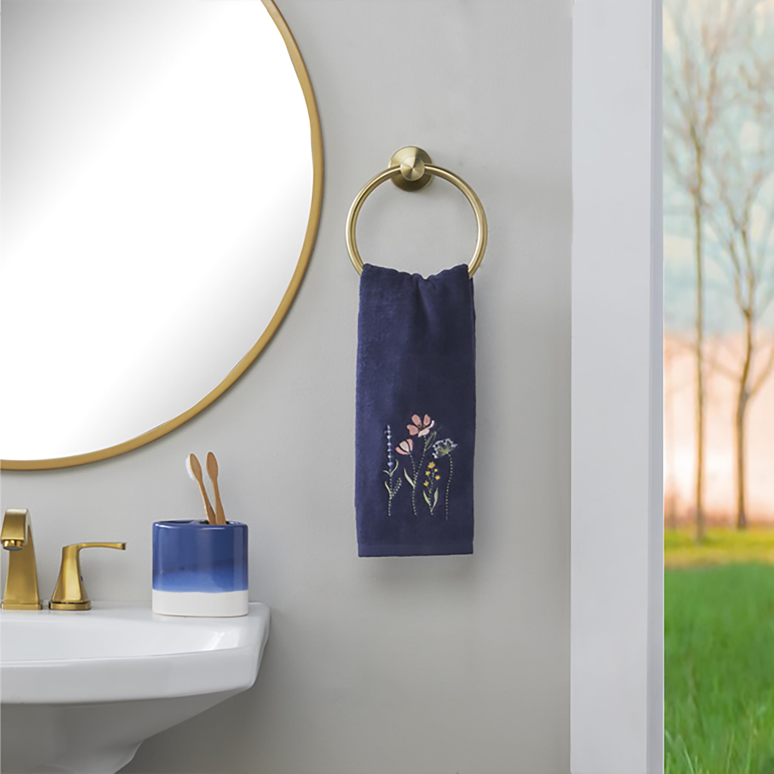 SKL Home Wildflower Field vibrant embroidery adds color to sink areas.