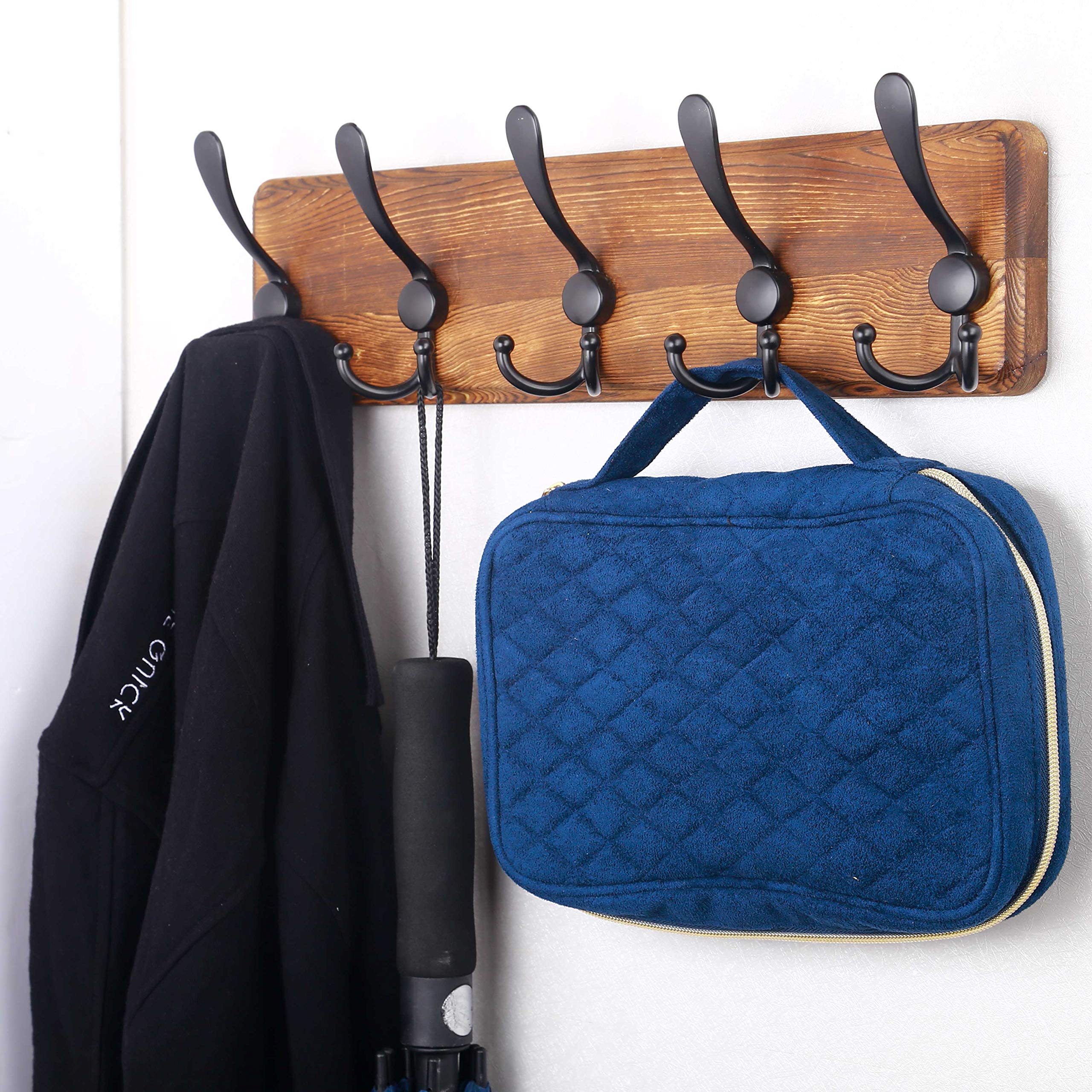 SKOLOO aluminum hook detail on pine plank highlighting durable hardware.