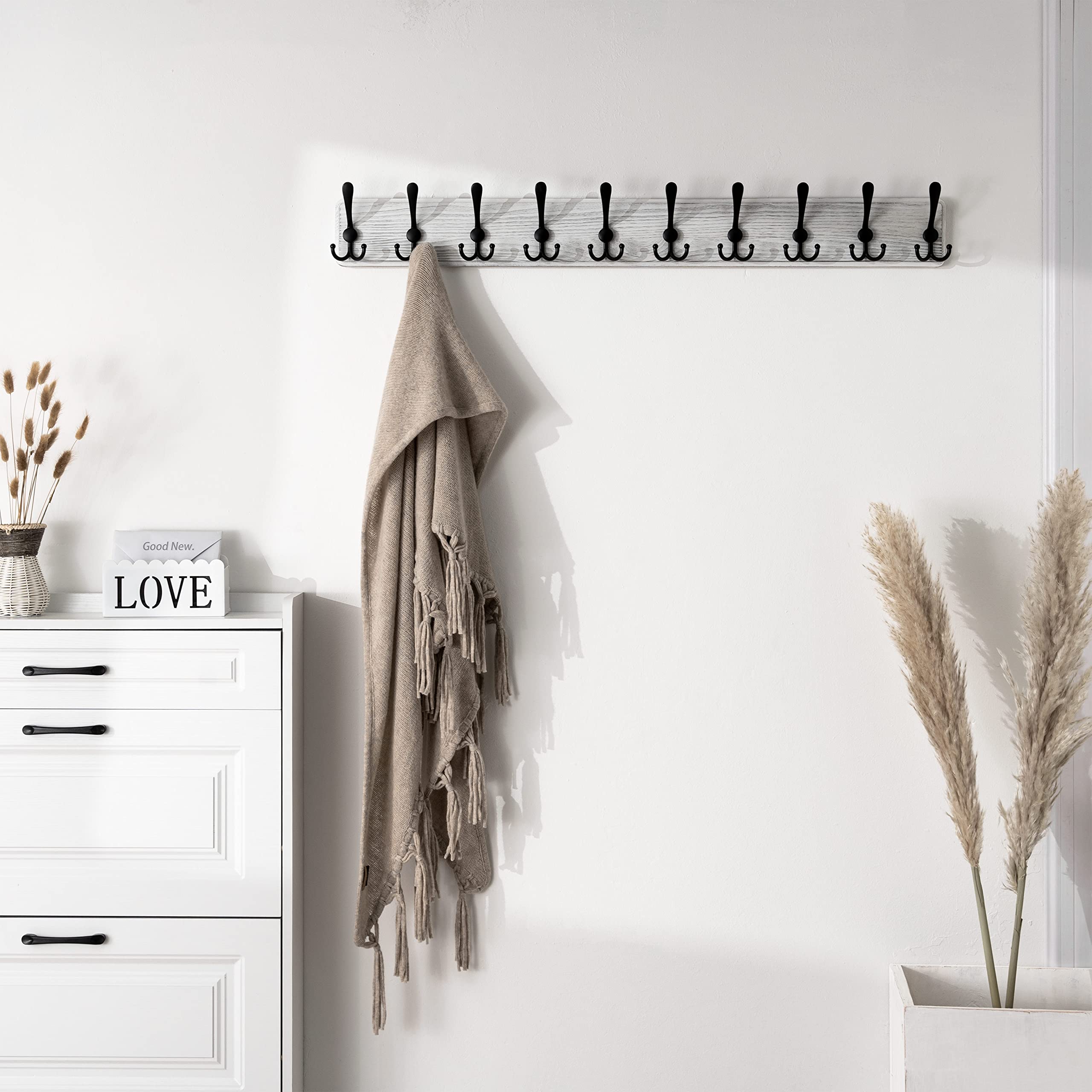 Closeup of SKOLOO coat rack hooks highlighting sturdy aluminum hardware