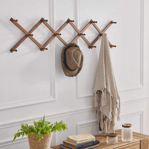 SKOLOO expandable wall-mounted coat rack saves space while organizing outerwear