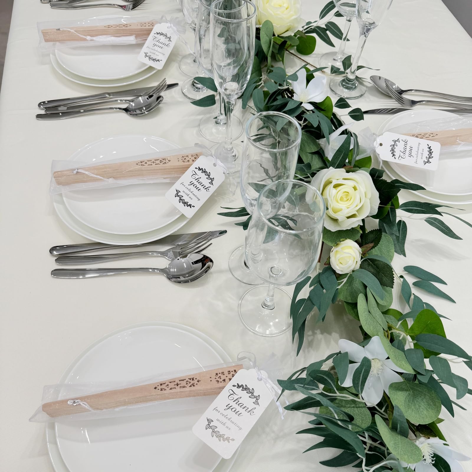 SL crafts white organza bags paired with fans for ready-to-gift presentation