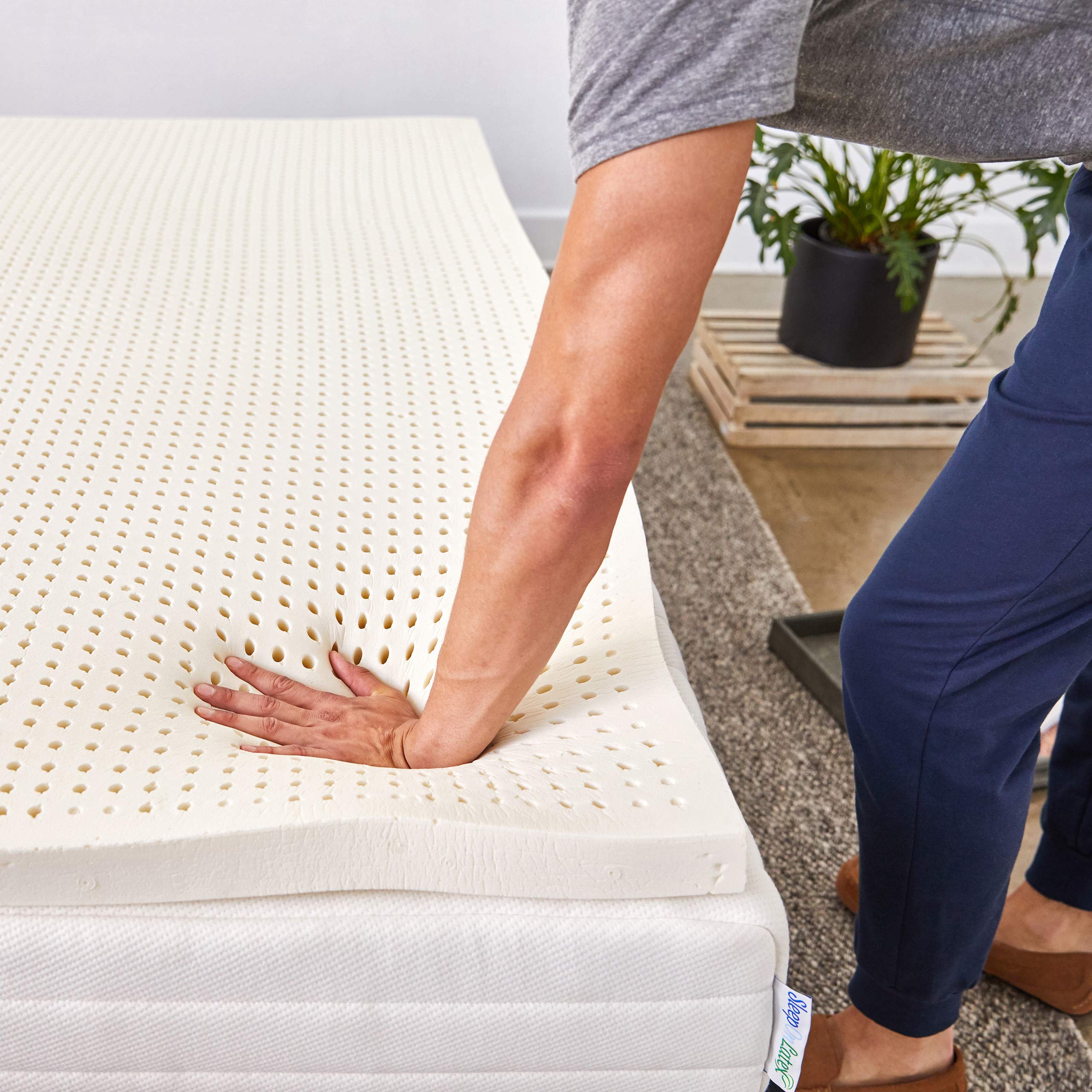 Sleep On Latex Pure Green topper on bed demonstrates easy integration with existing mattresses.