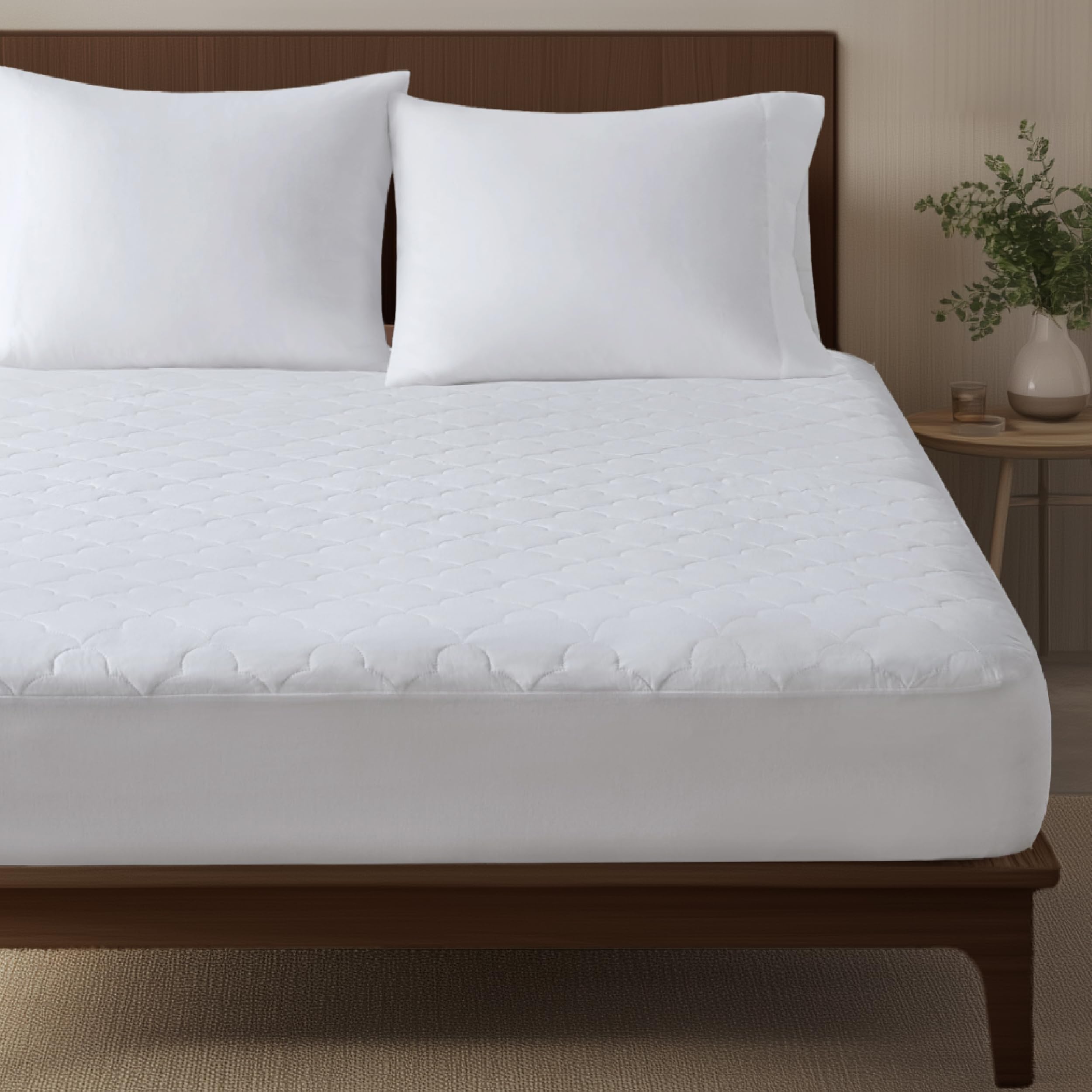 Sleep Philosophy twin mattress pad close-up shows cloud quilting for added softness.