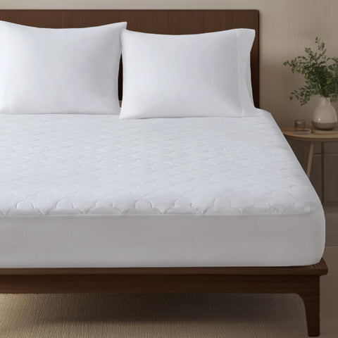Sleep Philosophy twin mattress pad close-up shows cloud quilting for added softness.