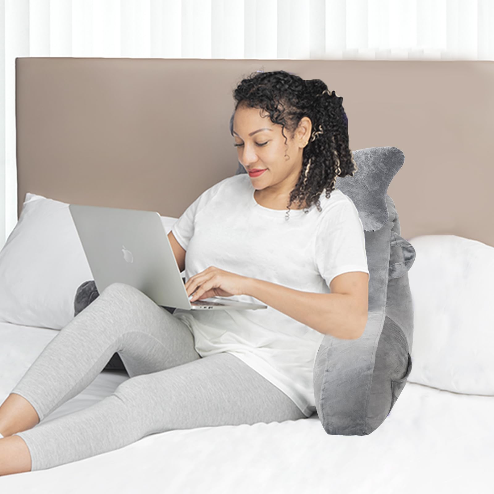 SLIGUY reading pillow shown on bed or couch for flexible use