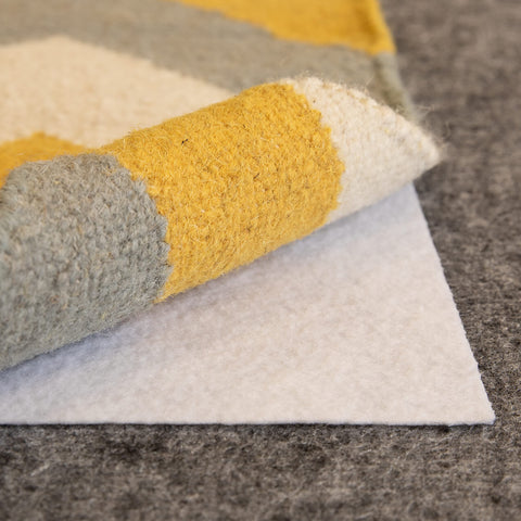 Slip-Stop Magic Stop low-profile design preserves rug feel and floor comfort