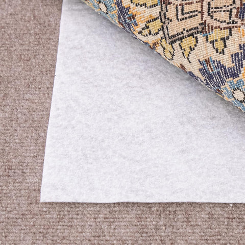 Slip-Stop Magic Stop rug pad demonstrates grip on carpet-over-carpet scenario.