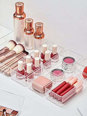 Clear drawer trays placed in a dresser for quick visibility