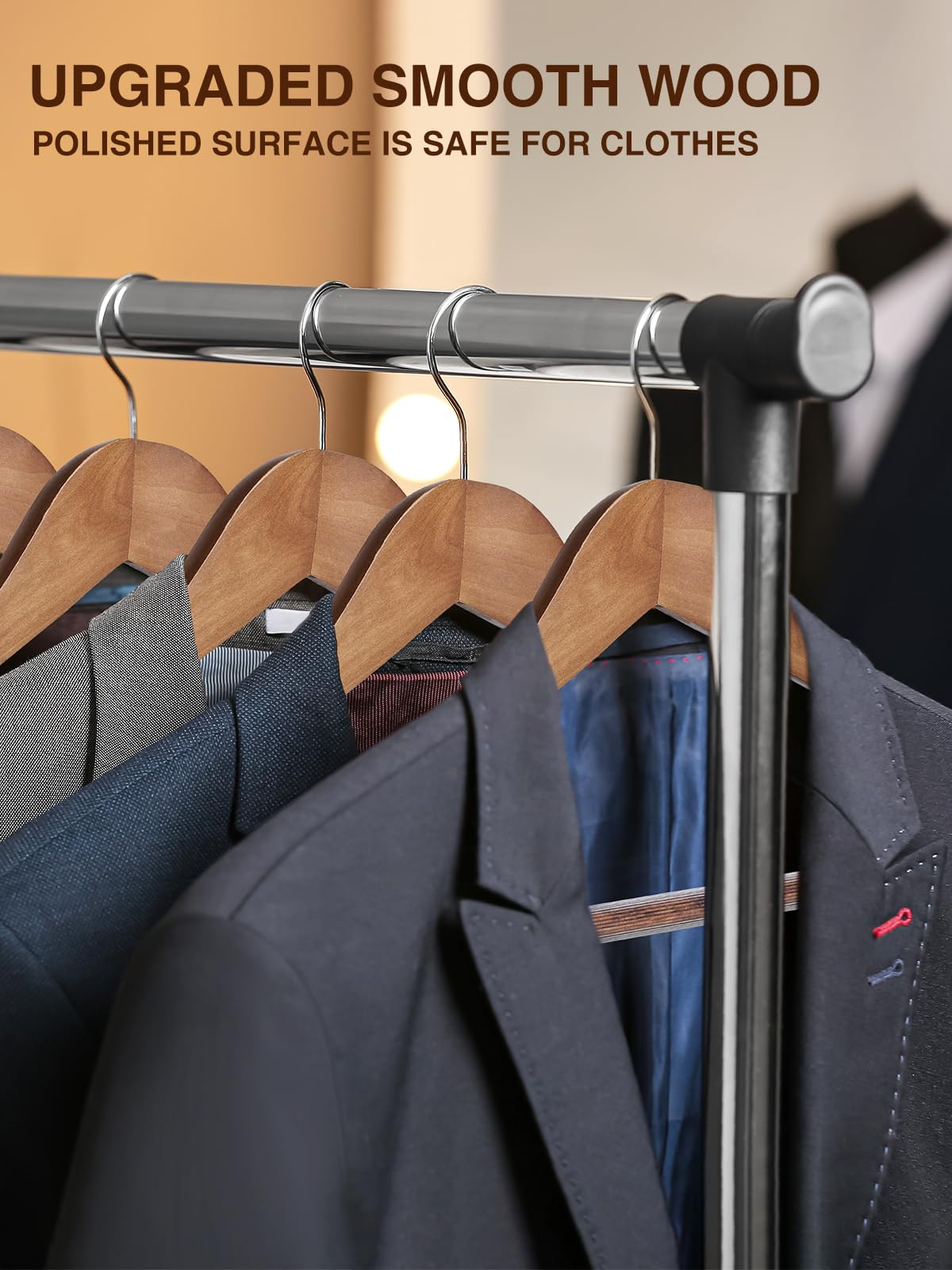 Smartor wide-shoulder suit hanger with pant bar preserves jacket shape.