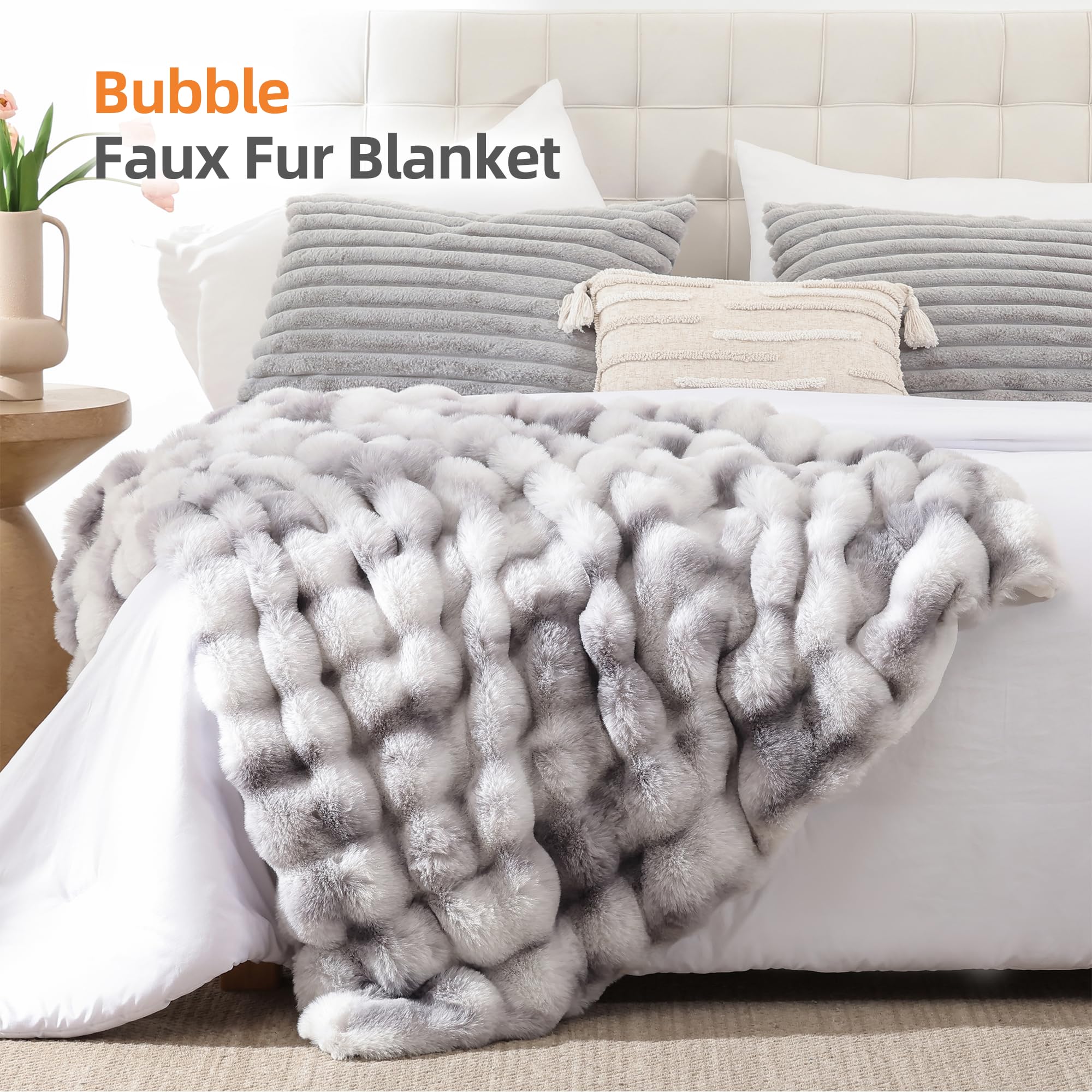 Smoofy tie-dye bubble blanket draped over a sofa for stylish warmth.