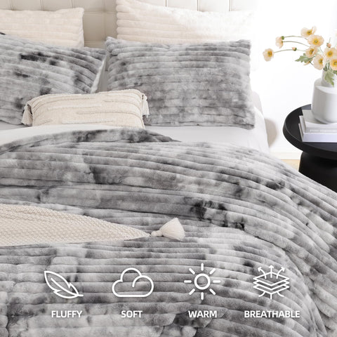 Smoofy tie-dye grey fleece texture highlighting plush warmth.