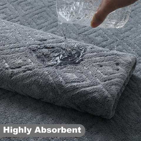 Smuge towels draped in a modern bathroom convey absorbency and texture