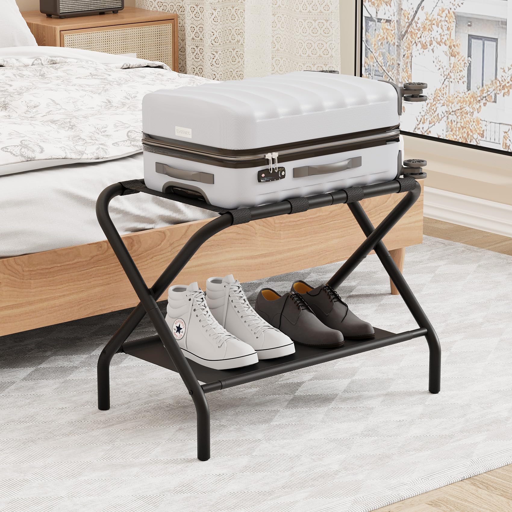 Smuxee black luggage rack assembled with top shelf for easy suitcase access.