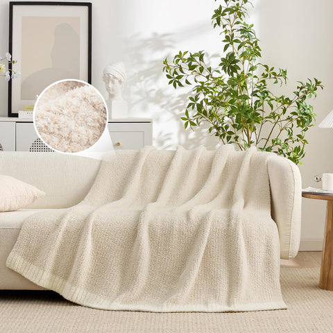 Snuggle Sac blanket draped over sofa creates inviting living room vignette