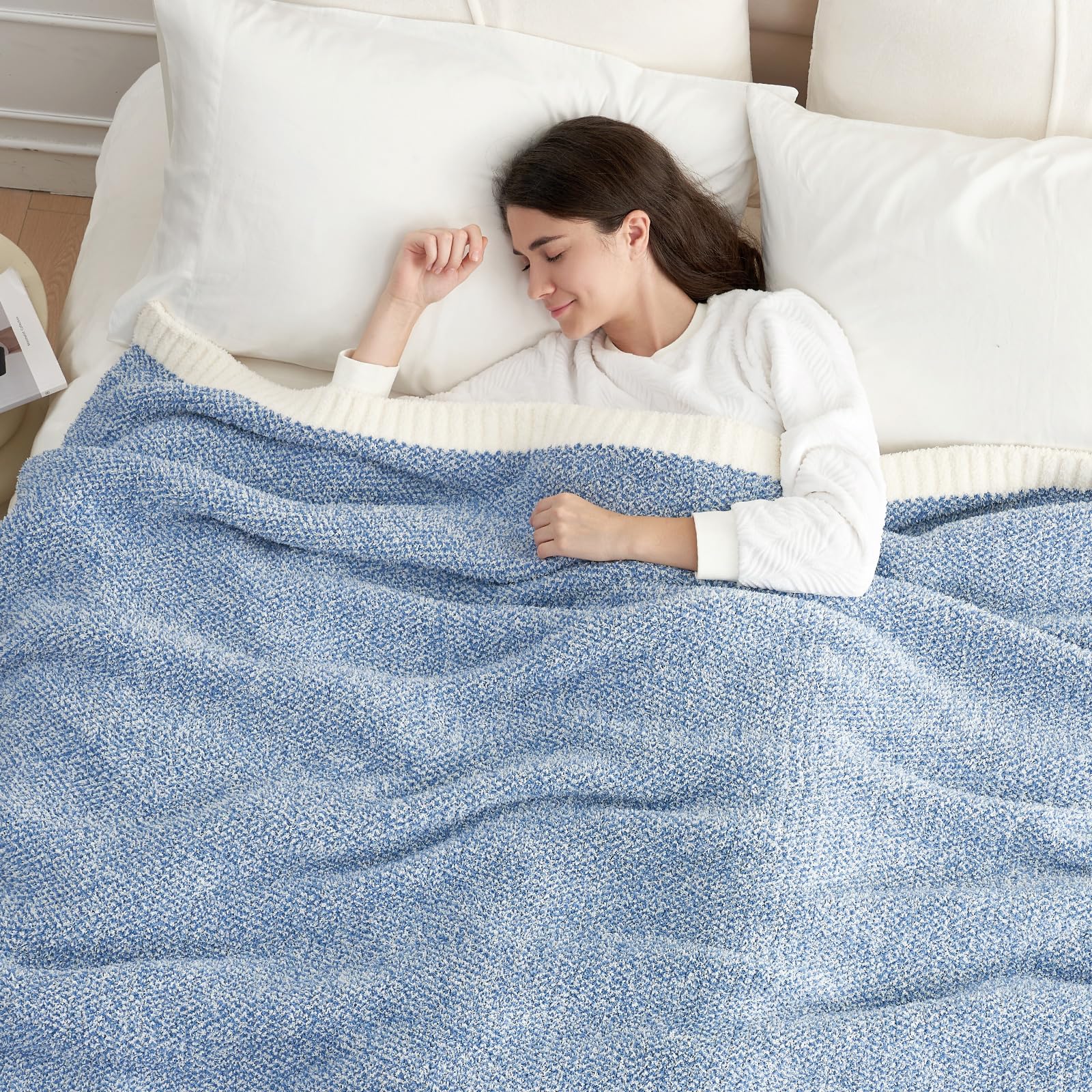 Snuggle Sac blue blanket draped on couch for a relaxed living room look.