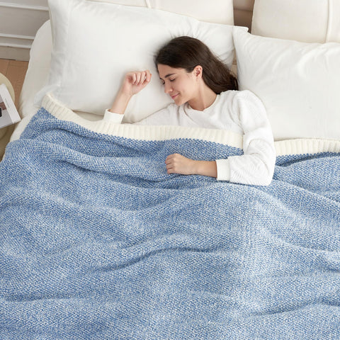 Snuggle Sac blue blanket draped on couch for a relaxed living room look.