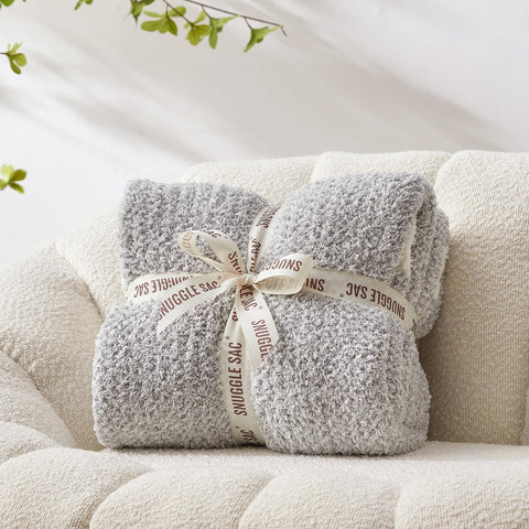 Snuggle Sac buttery grey throw folded to reveal reversible heather design