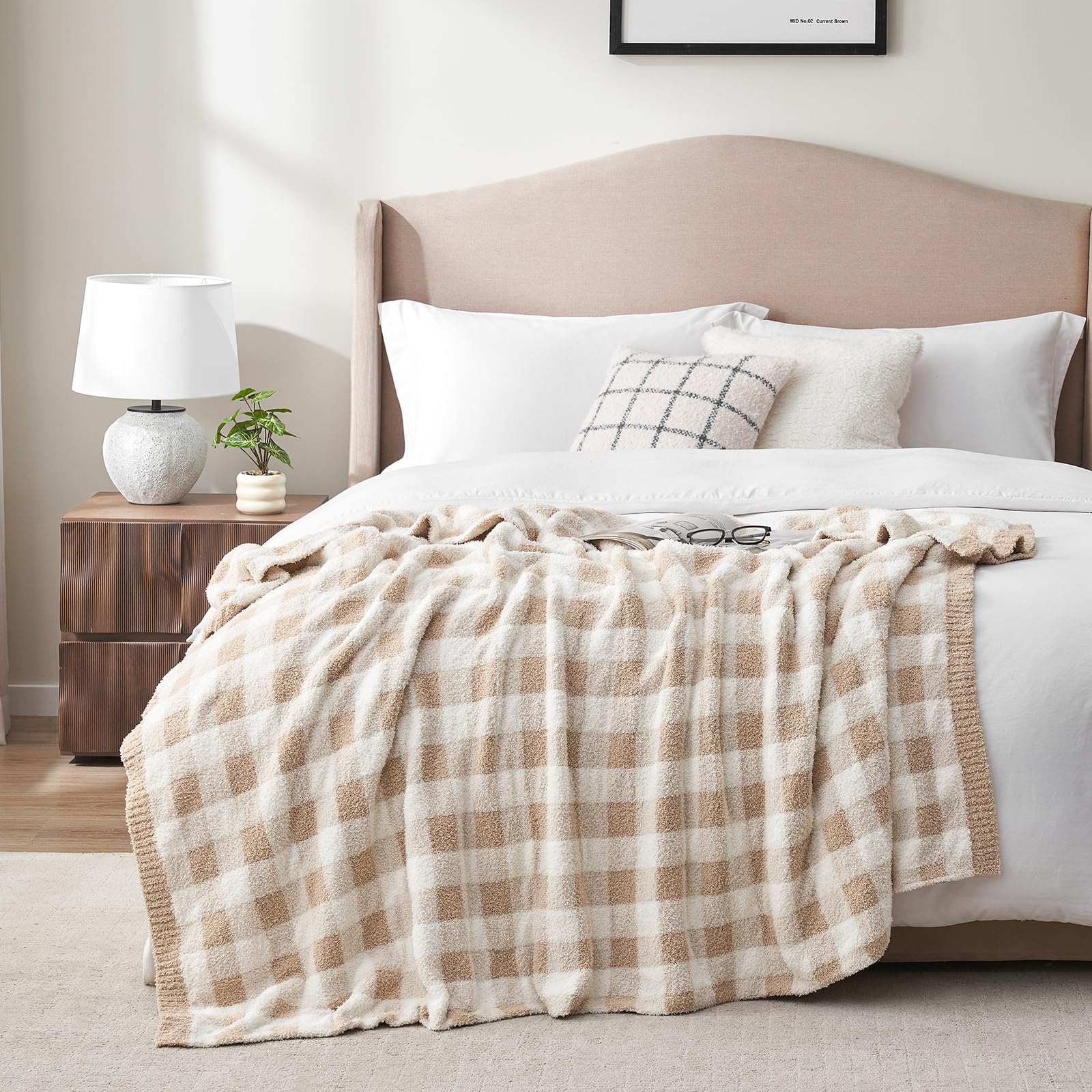 Snuggle Sac checkered blanket draped on sofa for warm decor