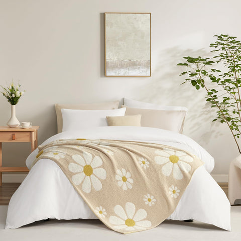 Snuggle Sac Flower throw folded on sofa ready for quick warmth