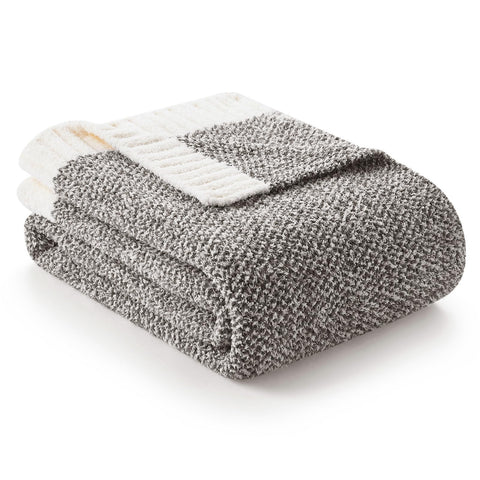 Snuggle Sac grey throw blanket with soft-knit texture for cozy sofa moments.