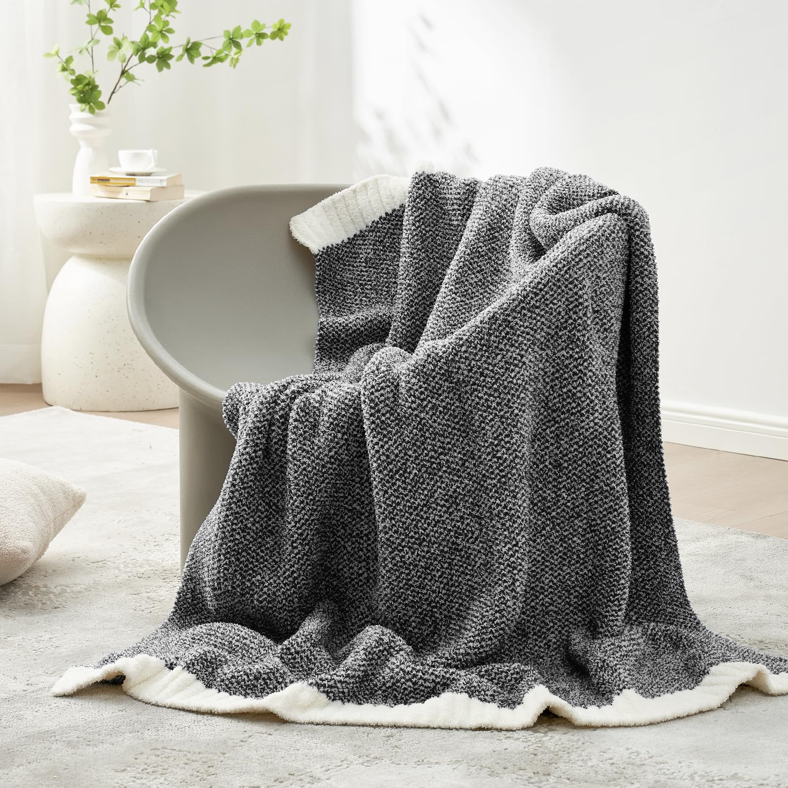 Snuggle Sac Heather Black reversible knit design highlighted for versatile, year-round coziness.