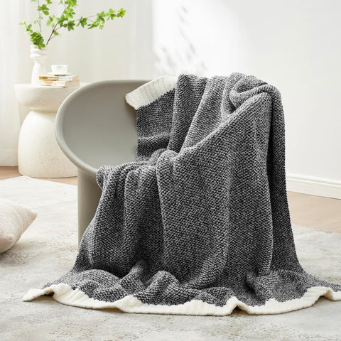Snuggle Sac Heather Black reversible knit design highlighted for versatile, year-round coziness.