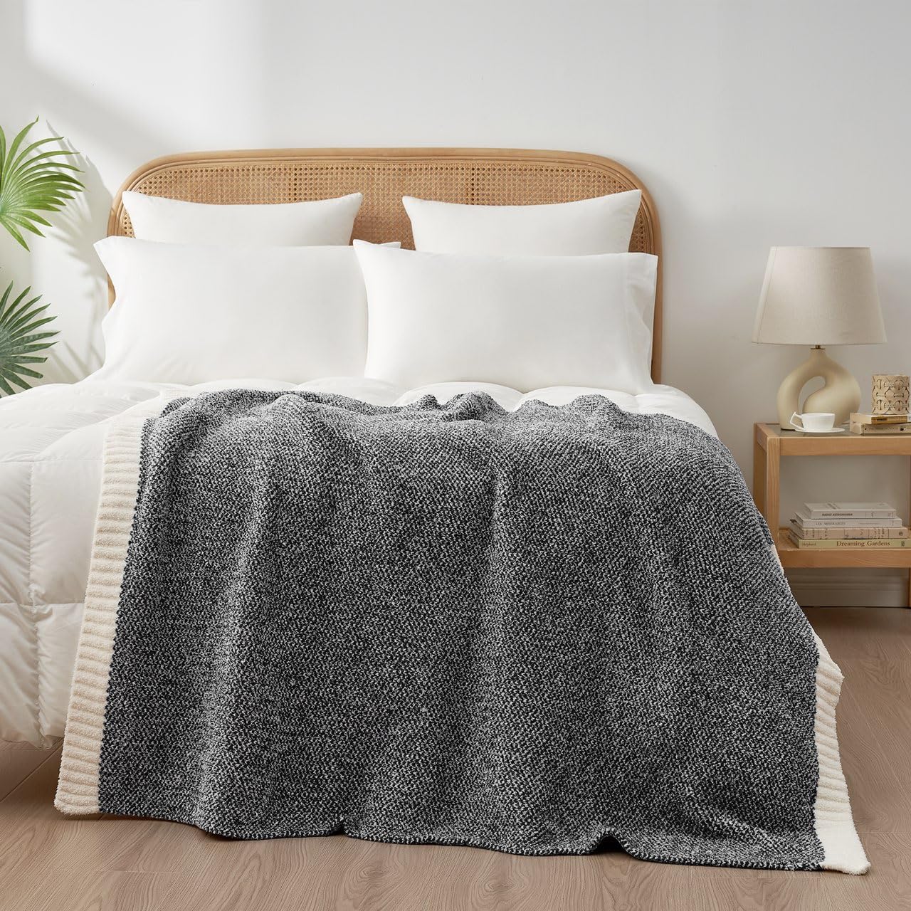 Snuggle Sac Heather Black travel-ready throw suitable for cars and flights.