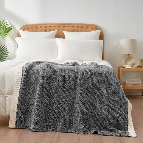 Snuggle Sac Heather Black travel-ready throw suitable for cars and flights.