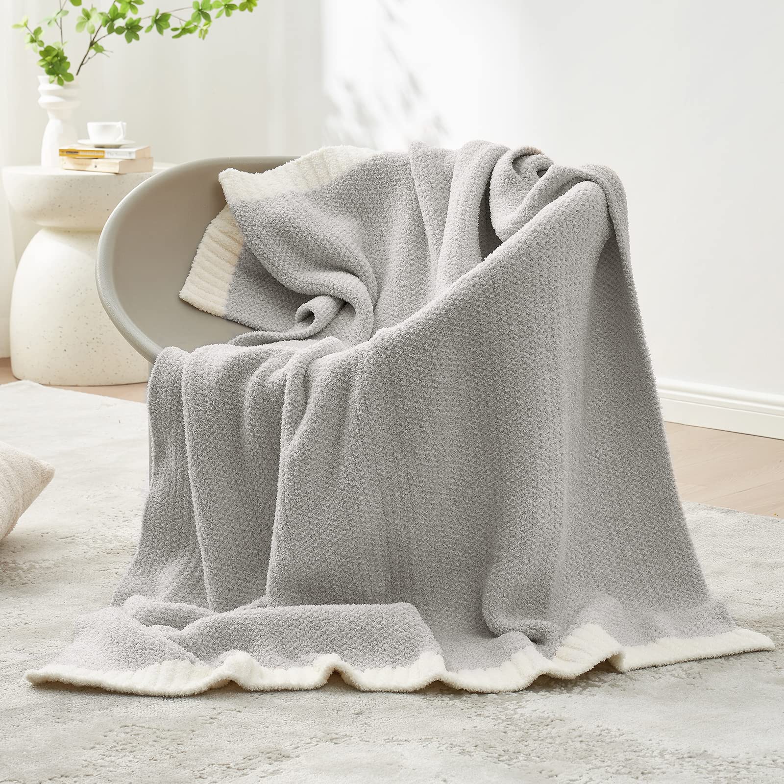 Snuggle Sac heather grey throw on sofa adding decorative warmth