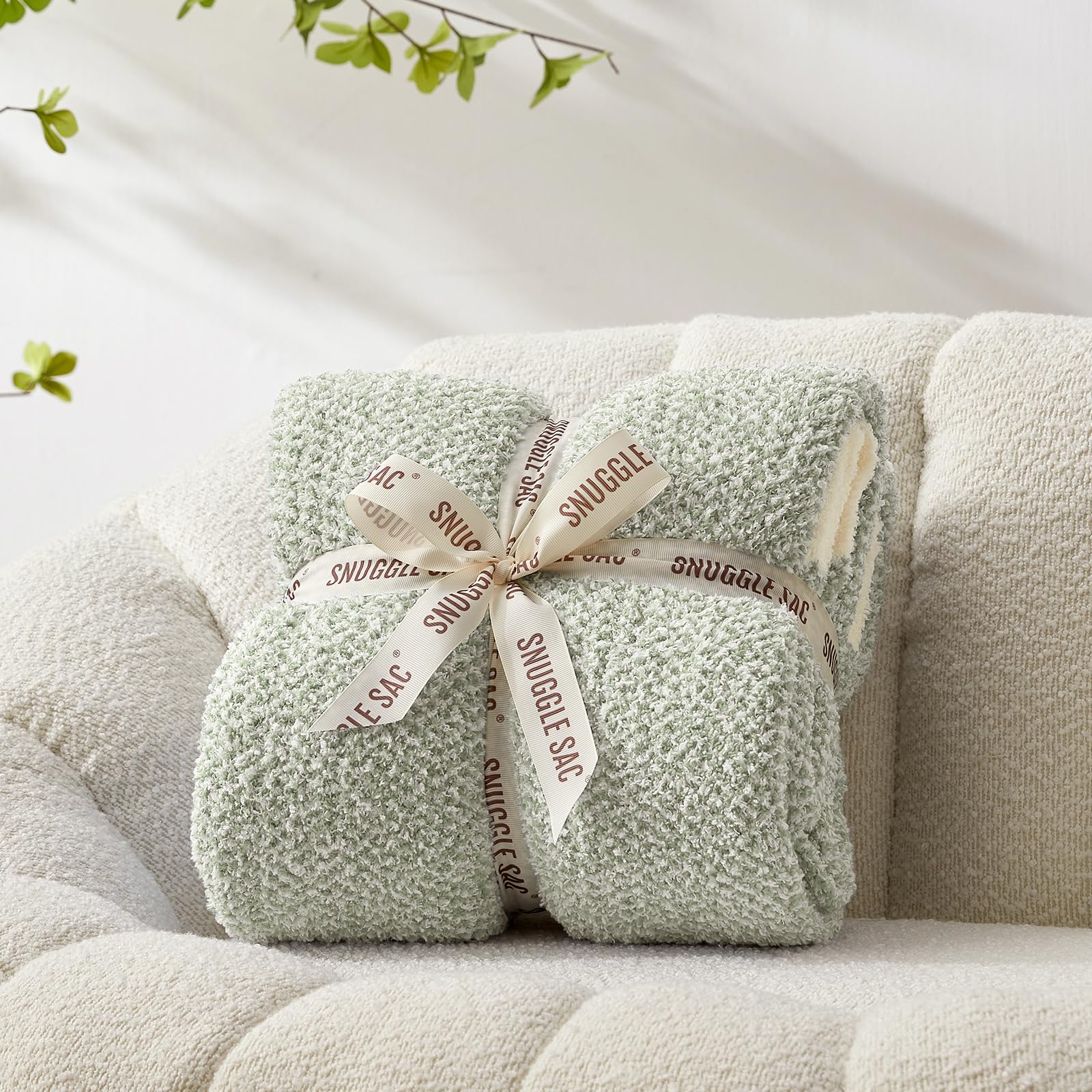 Snuggle Sac heather sage green throw, reversible knit for versatile styling and warmth.