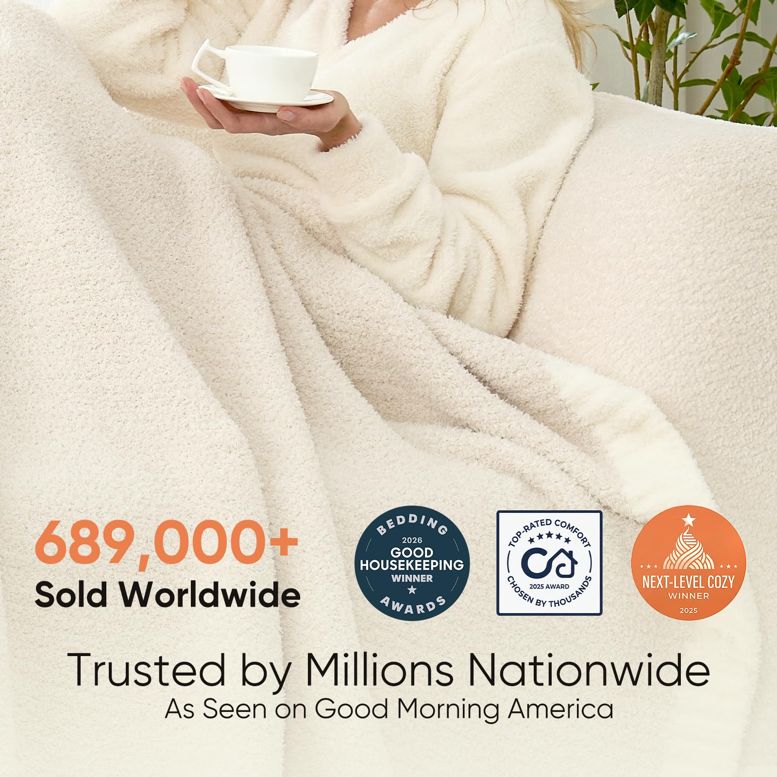 Snuggle Sac Heather Throw Blanket ivory folded on a couch enhances cozy decor.