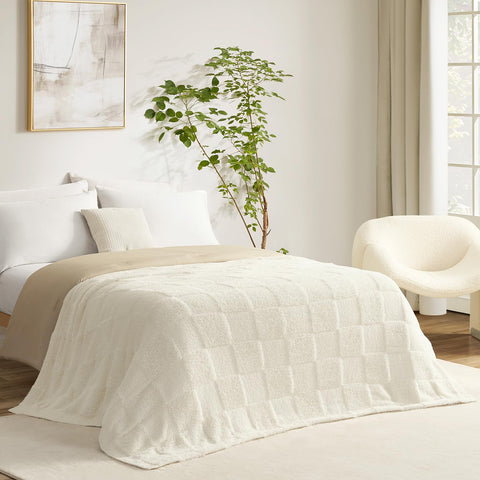 Snuggle Sac ivory throw draped on sofa shows soft, lightweight warmth.