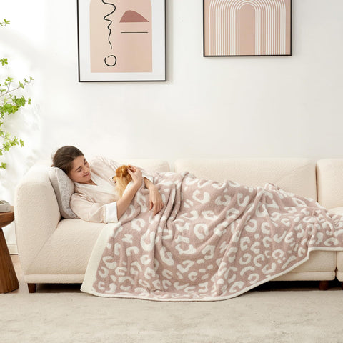 Snuggle Sac leopard blanket on bed adds luxurious softness for evenings.