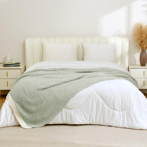 Reversible heather color knit from Snuggle Sac displayed on couch