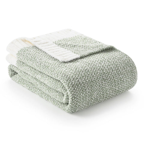 Snuggle Sac sage green throw blanket 50x70 on bed for cozy lounging