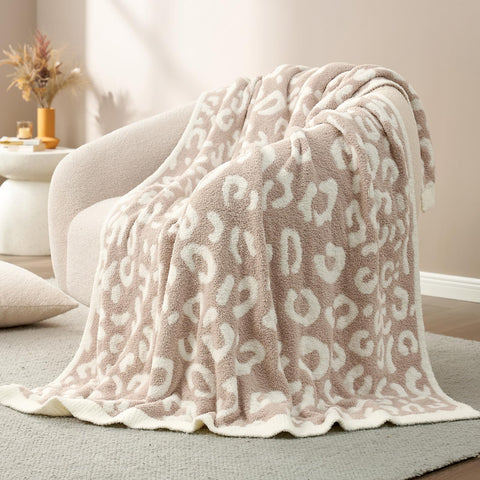 Snuggle Sac ultra-soft knit blanket showcases bold animal print.