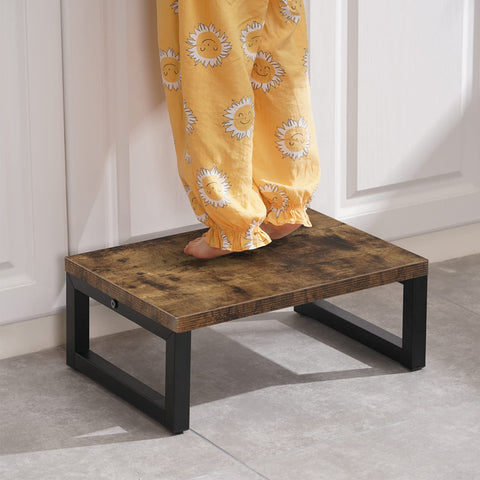 Snughome step stool being assembled with instructions