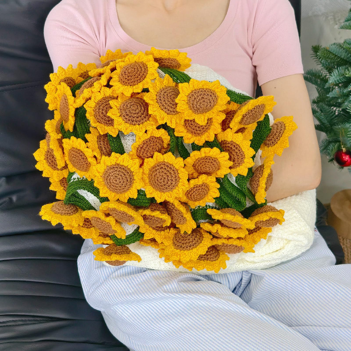 SoffMoiis crochet sunflower bouquet blanket on sofa for cozy decor