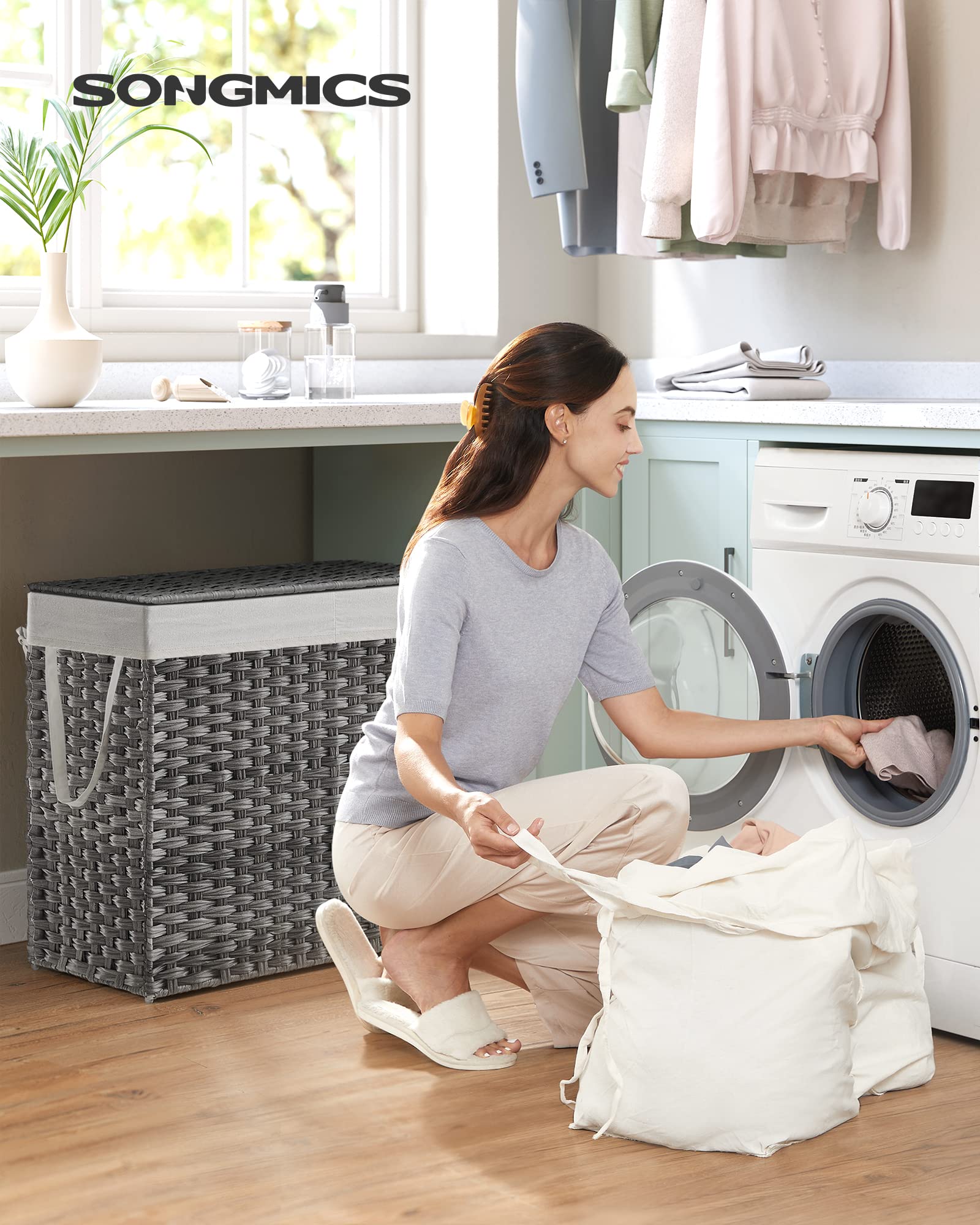 SONGMICS 130L hamper with two sections helps sorting whites and darks.