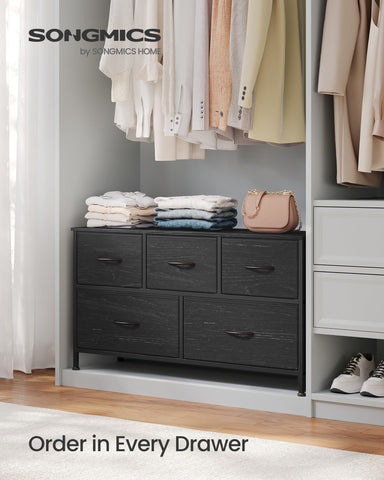 Songmics Bellah dresser top surface holding lamps and clocks for daily use.