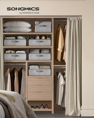 SONGMICS closet organizer with removable divider for customizable storage.
