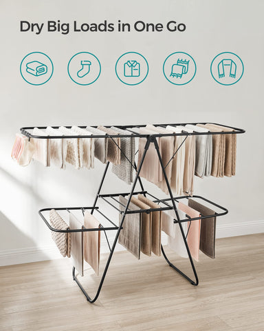 Height adjustable wings on Songmics rack for different garment lengths.