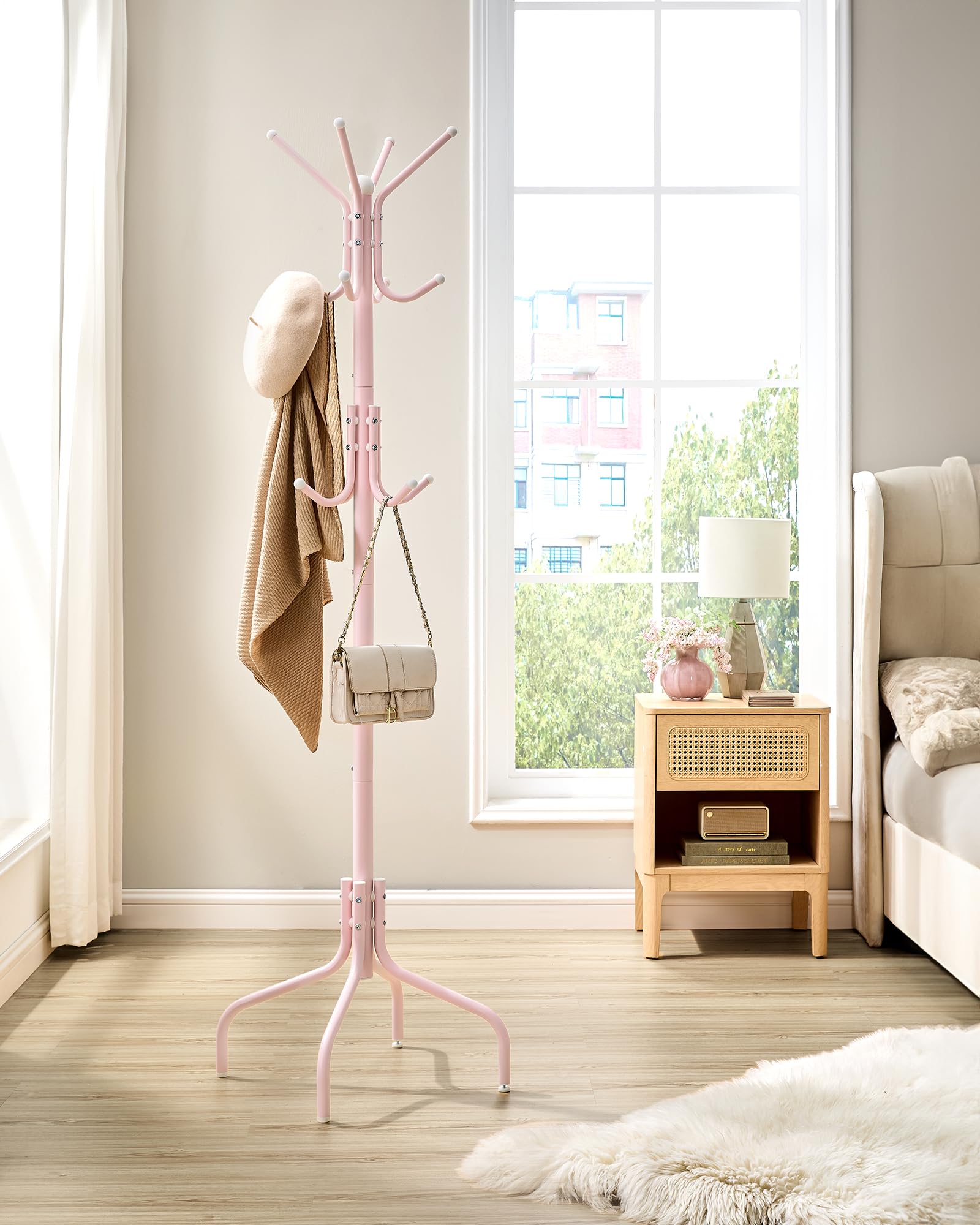 SONGMICS jelly pink finish coat rack adds a playful focal point to rooms.